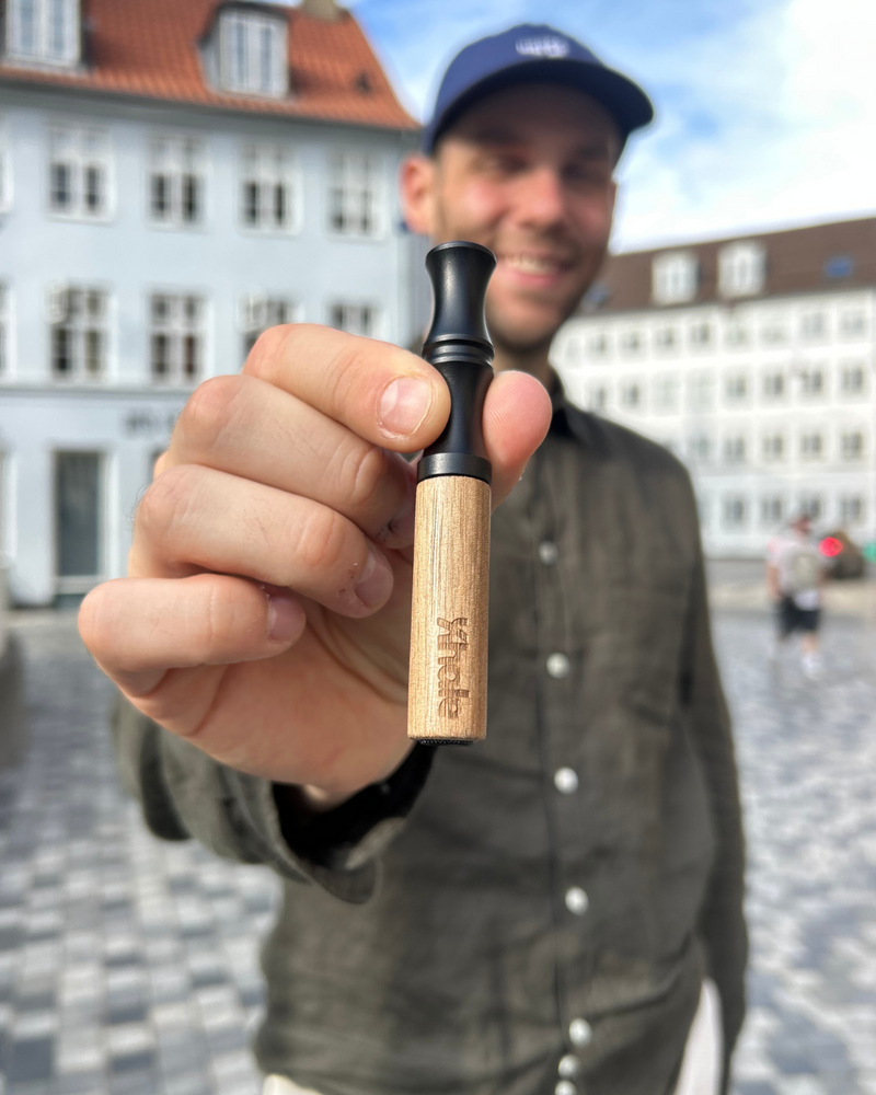 Man holding Xhale Walnut